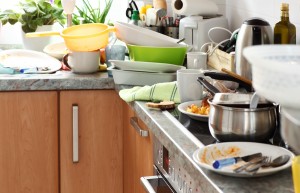 Pile of dirty dishes in the kitchen - Compulsive Hoarding Syndro