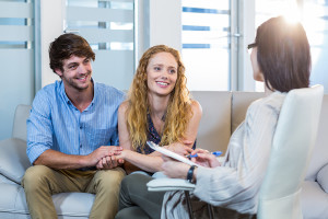 Psychologist and happy couple in the office